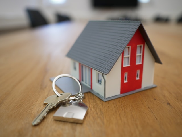 Model house with a set of keys next to it